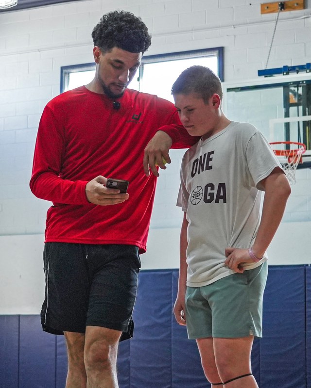 Coach Draig Cooley reviewing video with a young player during a training session